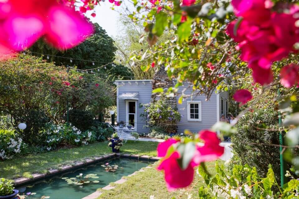 The Edison study is photographed through flowers in the Moonlight Garden in The Edison and Ford Winter Estate in Fort Myers, Florida. PHOTOGRAPH BY JÖRG MODROW, LAIF/REDUX